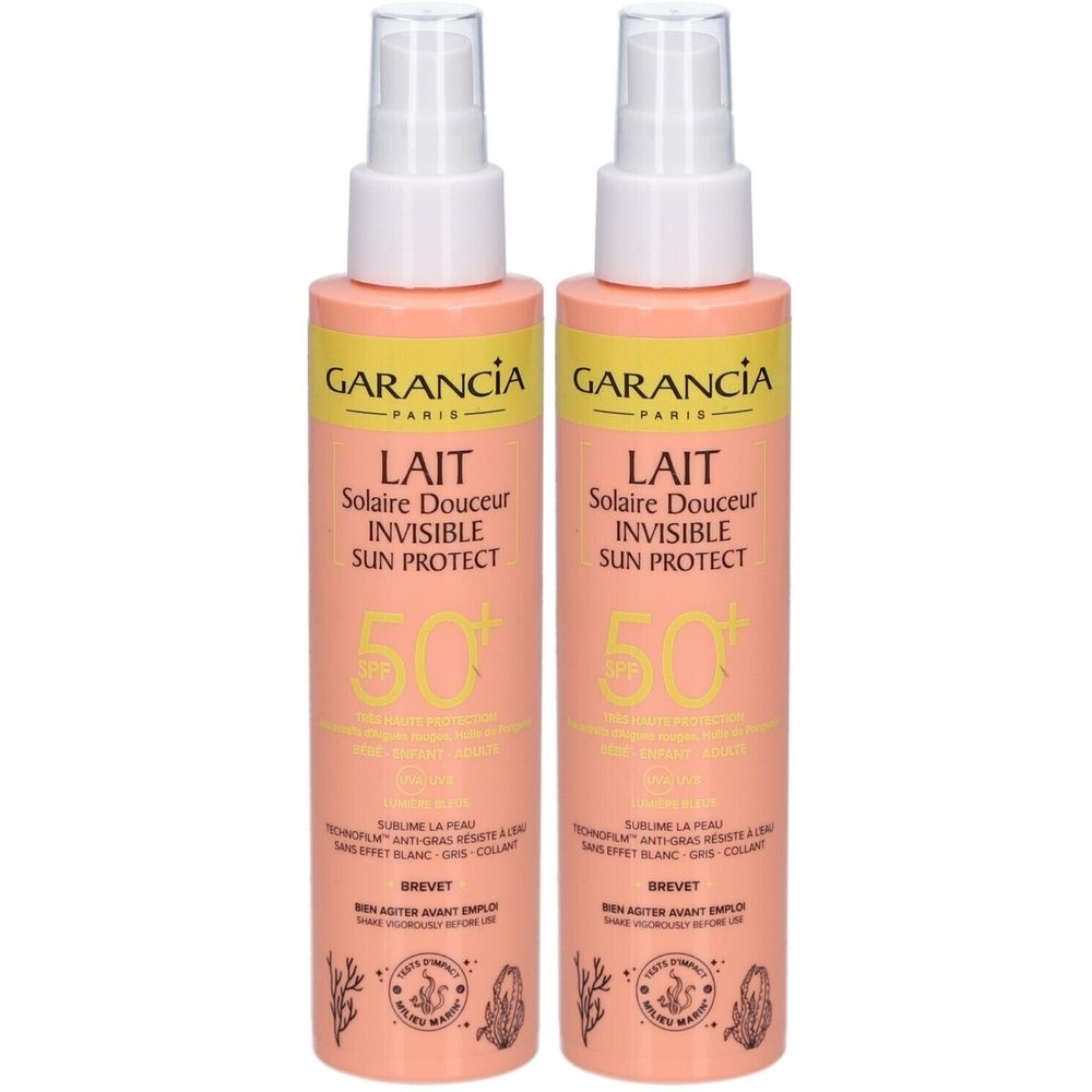 Deux flacons de lait solaire avec vaporisateur. Inscription: GARANCIA, LAIT Solaire Douceur Invisible Sun Protect, SPF 50+.