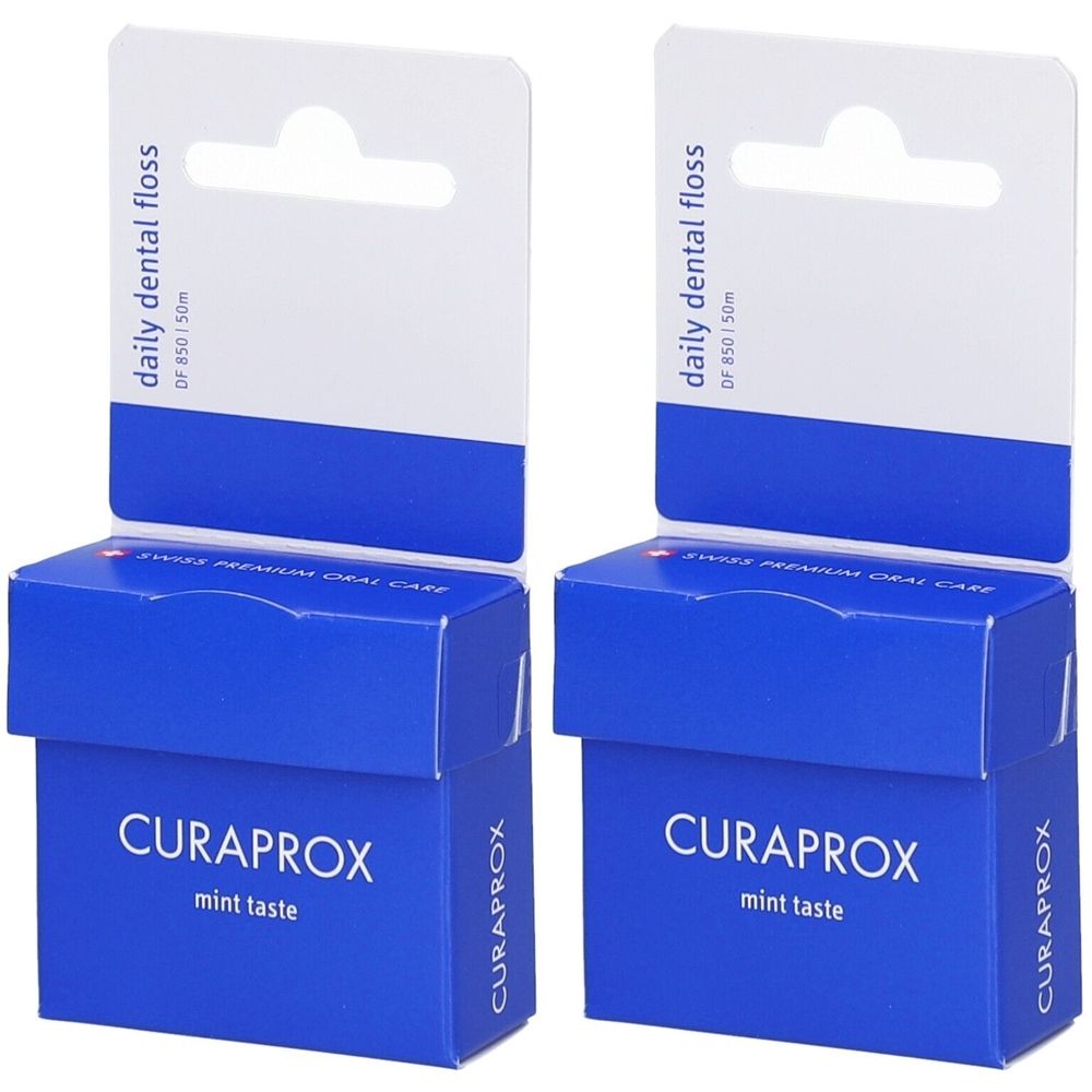 Deux boîtes bleues avec accroche blanche. Inscription : CURAPROX, mint taste. En haut : daily dental floss, DF 850/50m.