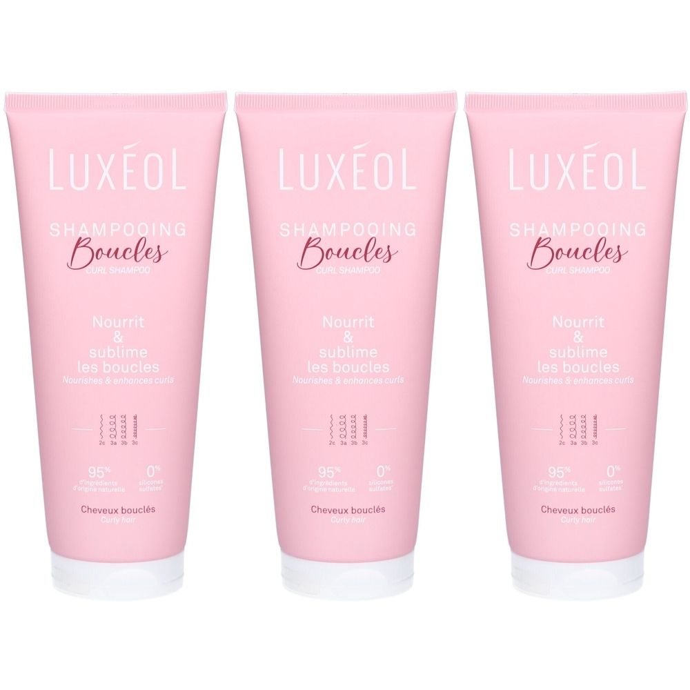 Drei rosa Tuben Shampoo. Auf jeder steht "LUXÉOL", "Shampooing Boucles" und "Nourrit & sublime les boucles".