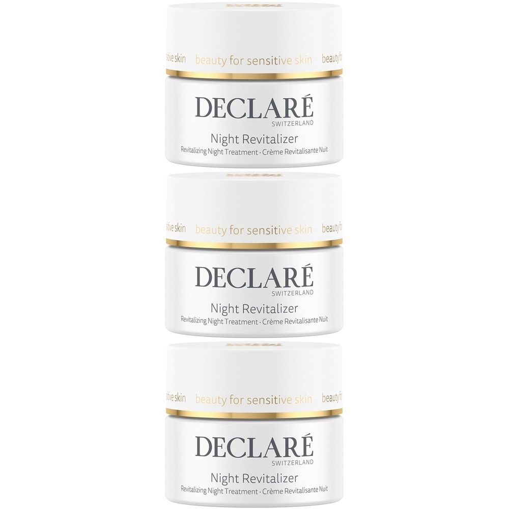 Drei weiße Tiegel mit goldfarbenen Rändern. Auf jedem Tiegel steht "DECLARÉ Switzerland Night Revitalizer".