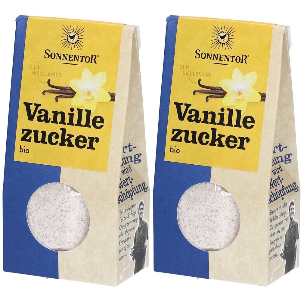 Zwei Beutel mit Vanillezucker. Auf gelbem Feld steht "Vanillezucker bio" und "SONNENTOR". Durchsichtiges Fenster zeigt den Inhalt.
