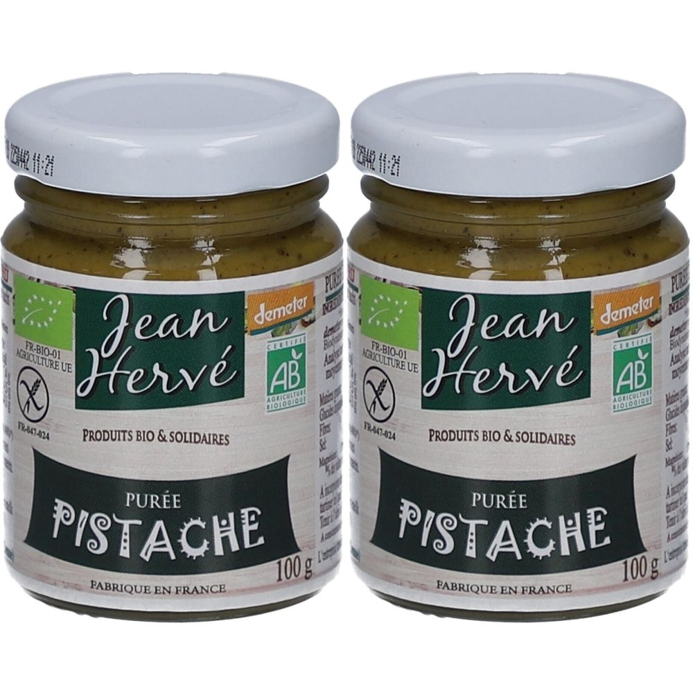 Deux pots de purée de pistaches. Inscriptions "Jean Hervé", "Purée Pistache", labels bio. Couvercles blancs, pâte verte, pots en verre.