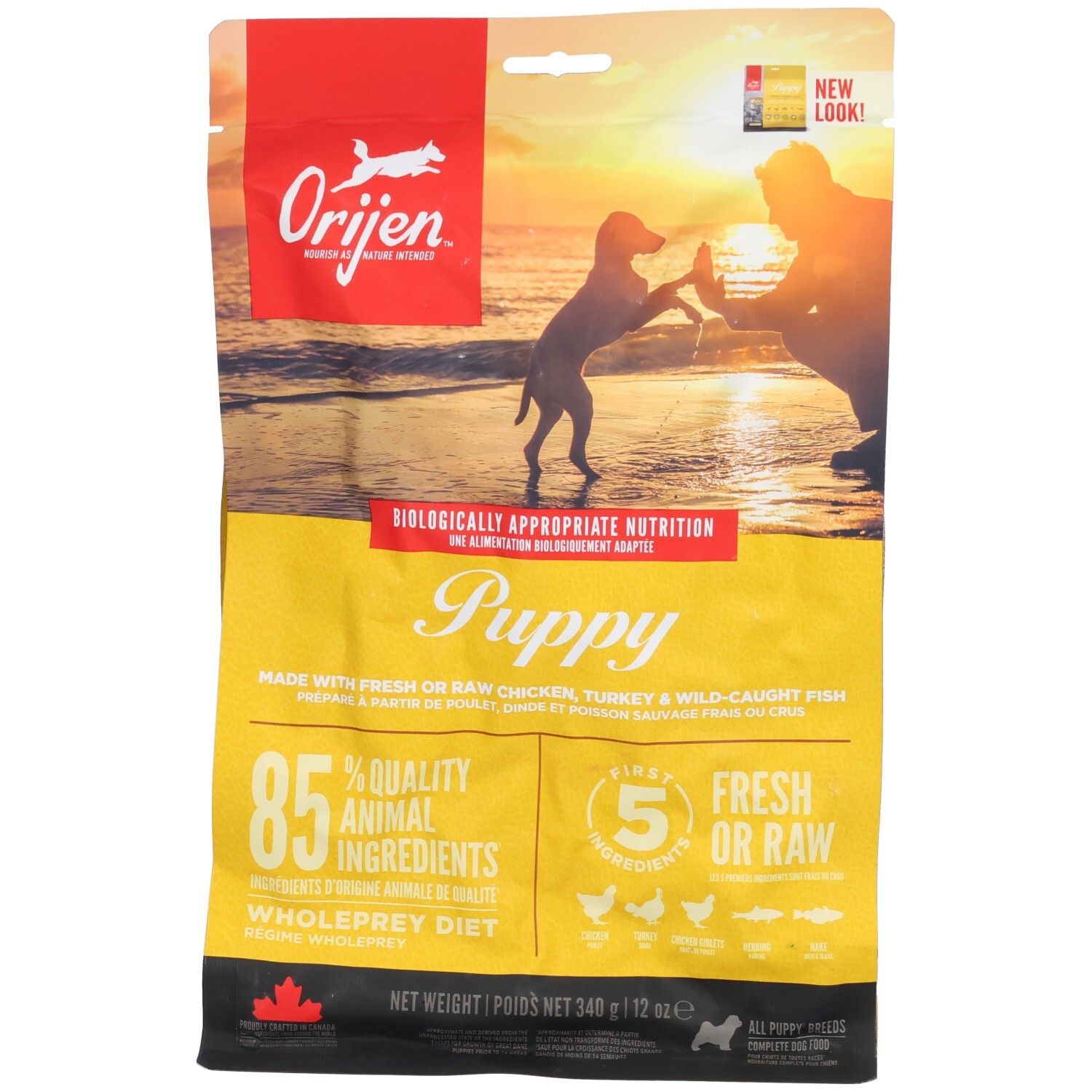 Gelbe Tüte mit ORIJEN-Logo und Welpen-Illustration. Text: Puppy, 85% tierische Zutaten, 5 frische/rohe Zutaten. Nettoinhalt: 340g.