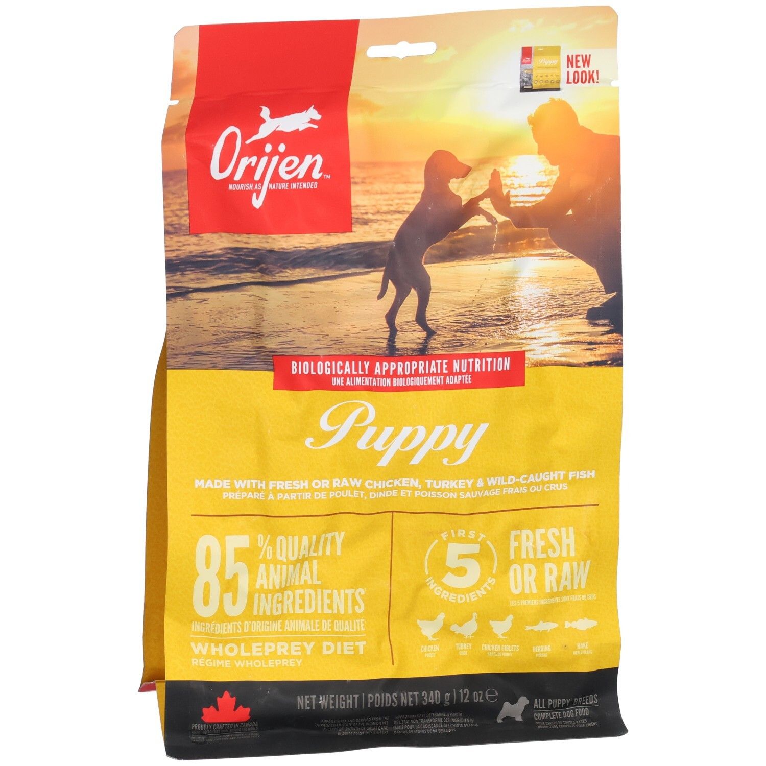 Gelbe Tüte mit ORIJEN-Logo und Welpen-Illustration. Text: Puppy, 85% tierische Zutaten, 5 frische/rohe Zutaten. Nettoinhalt: 340g.