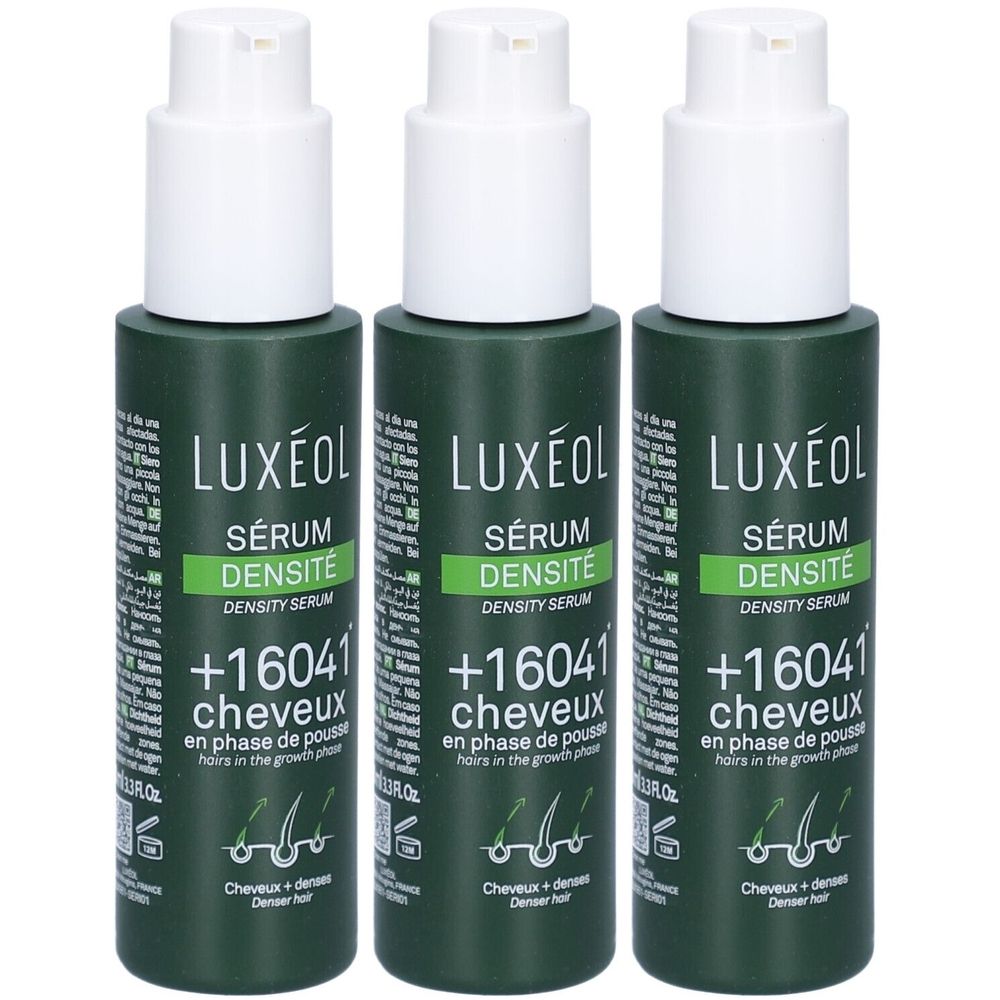Drei grüne Flaschen mit weißem Pumpkopf. Aufschrift: LUXÉOL Sérum Densité, +16041 cheveux, en phase de pousse.