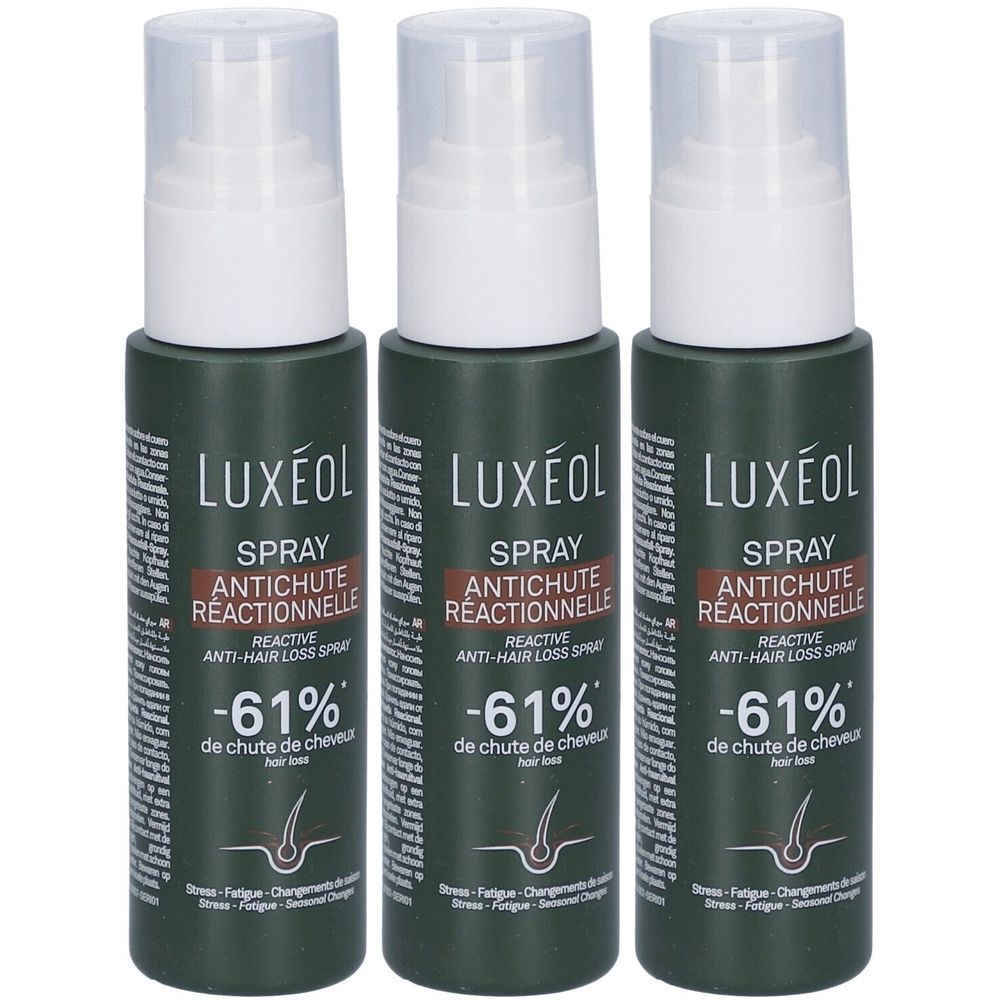 Trois flacons de spray LUXÉOL antichute réactionnelle. Flacons vert foncé avec tête de pulvérisation blanche. Inscription : -61 % de chute de cheveux.