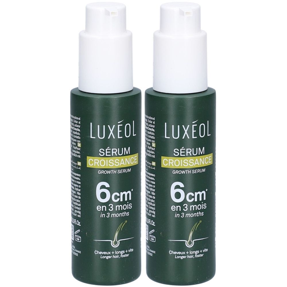 Zwei grüne Flaschen mit weißem Pumpkopf. Aufschrift: LUXÉOL Sérum Croissance, 6 cm in 3 Monaten. Für längeres Haar.