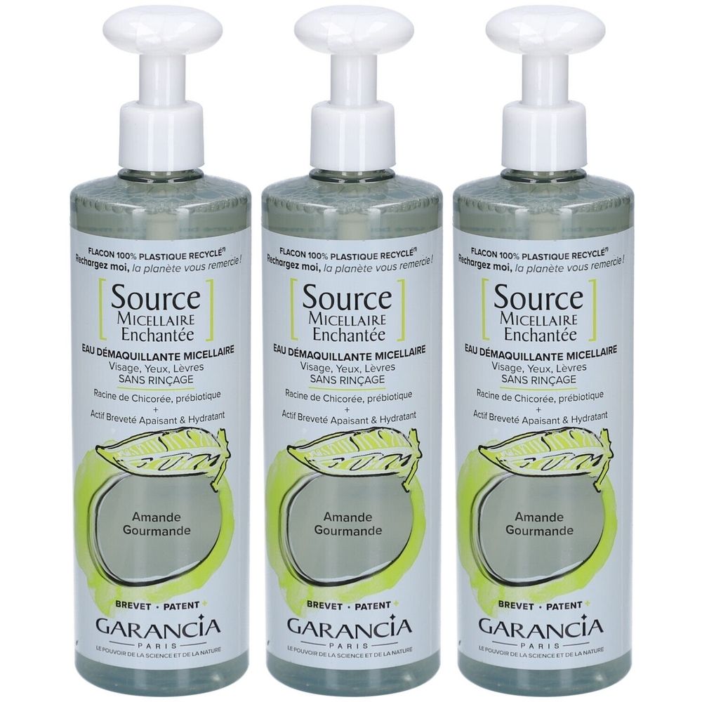 Trois flacons de Garancia Eau Micellaire Enchantée. Pompes blanches, liquide vert, étiquette avec texte et logo.