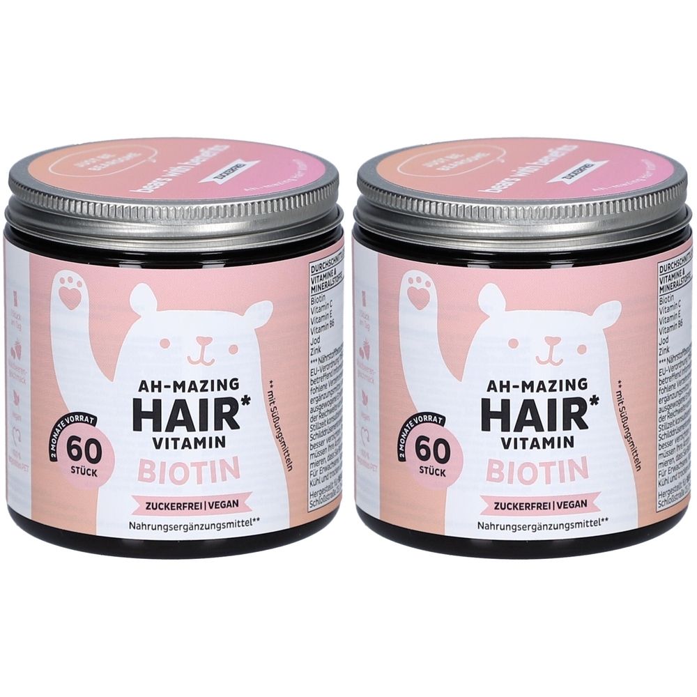 Zwei Dosen mit rosa Etiketten. Aufschrift: AH-MAZING HAIR Vitamin Biotin. 60 Stück. Zuckerfrei Vegan. Nahrungsergänzungsmittel.