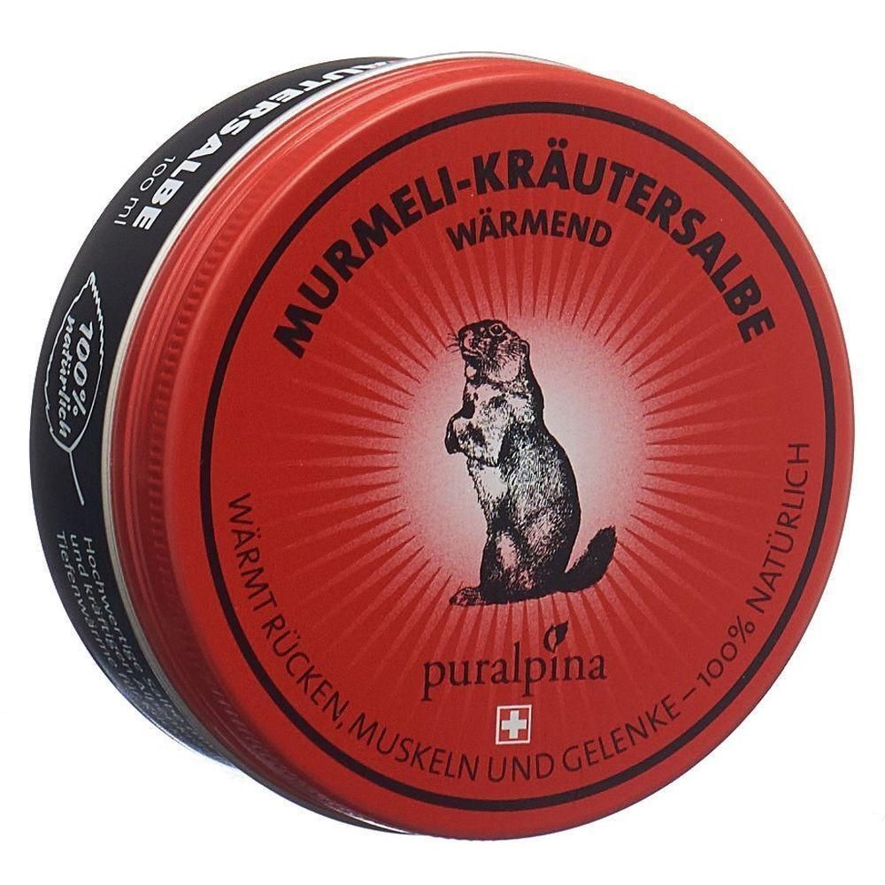 Boîte ronde rouge. Inscription: Murmeli-Kräutersalbe, chauffant. Logo: marmotte. Marque: puralpina. Avec croix suisse.