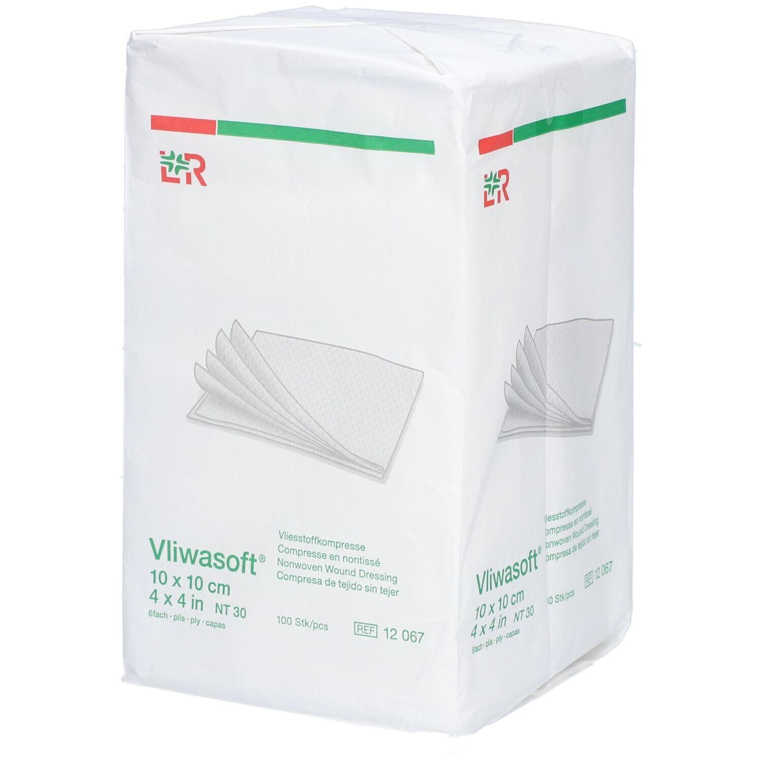 Paquet de compresses en non-tissé blanches. Inscription : Vliwasoft, 10 x 10 cm, 4 x 4 pouces. Contient 100 pièces. Logo vert et rouge.