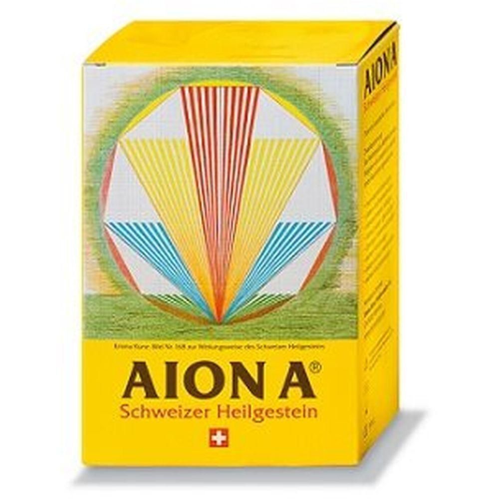 Boîte jaune avec logo AION A® et croix suisse. Motif géométrique rayonnant multicolore. Texte: Schweizer Heilgestein.