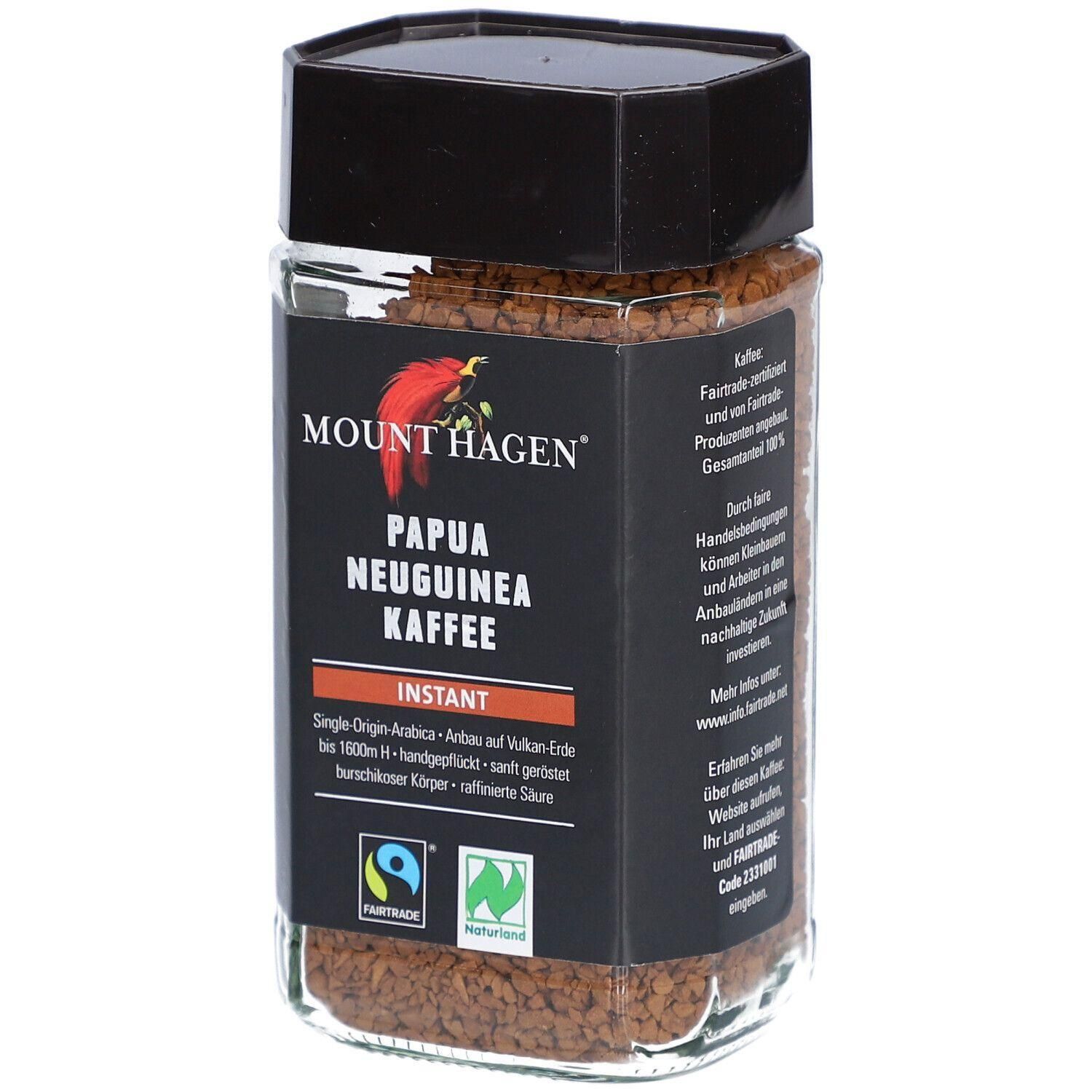 Glasbehälter mit Instantkaffee. Schwarzes Etikett mit rotem Vogel-Logo und Schriftzug Mount Hagen, Papua Neuguinea Kaffee.