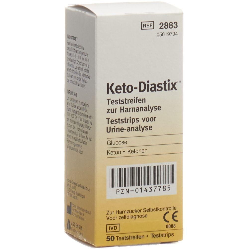 Karton mit Keto-Diastix Teststreifen. Aufschrift: Teststreifen zur Harnanalyse, Glucose, Keton, 50 Teststreifen. CE-Kennzeichnung.