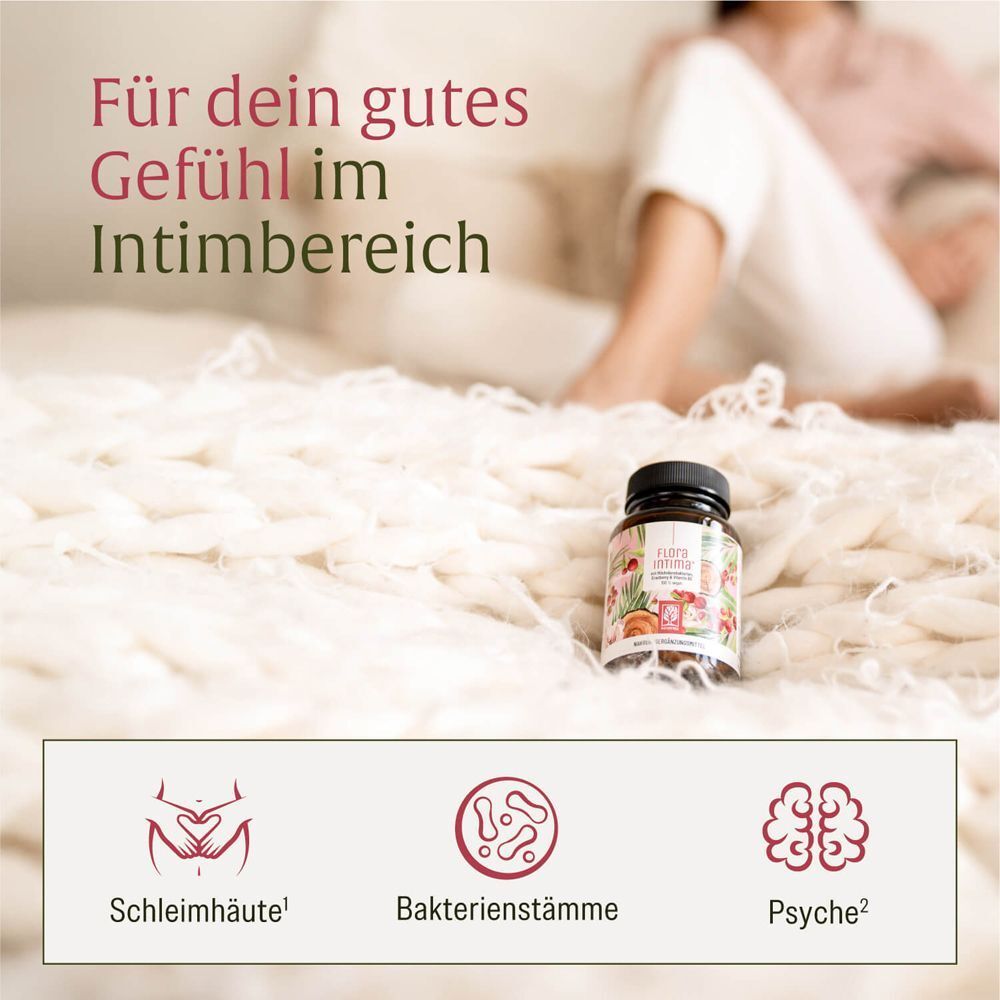 Produktflasche auf Bettdecke. Text: Für dein gutes Gefühl im Intimbereich. Darunter Icons: Schleimhäute, Bakterienstämme, Psyche.
