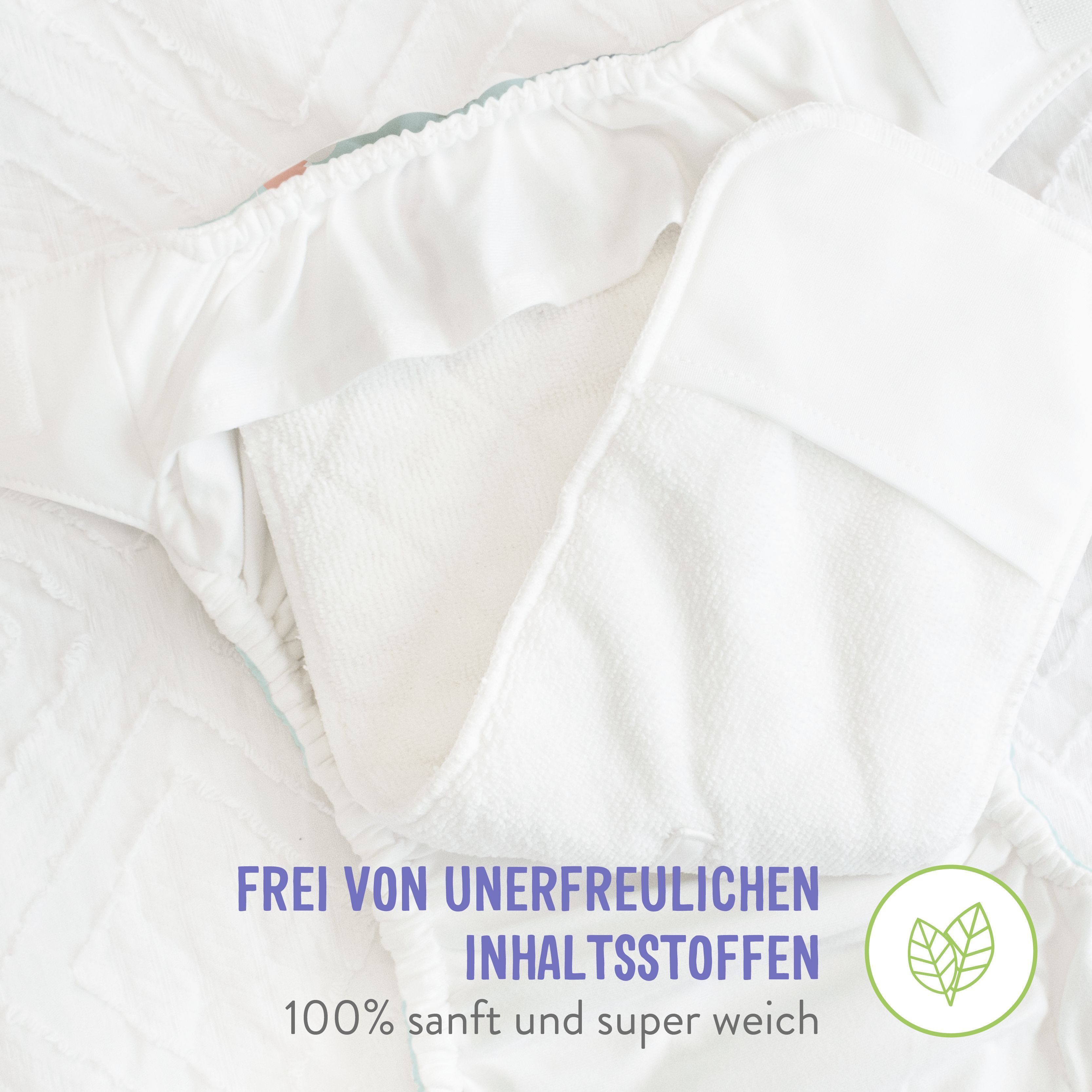 Couche ouverte avec doublure intérieure blanche. Texte : Sans ingrédients indésirables. 100% doux et super doux.