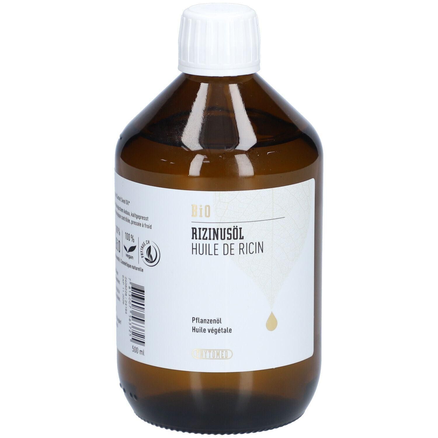 Braune Glasflasche mit weißem Deckel. Aufschrift: BIO Rizinusöl, Huile de Ricin. Tropfensymbol. Label mit Logos.