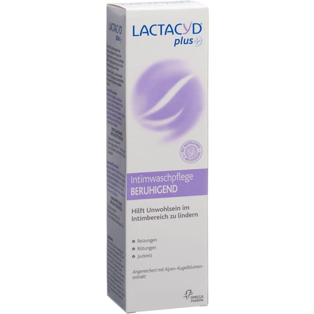 Boîte blanche avec informations produit. LACTACYD plus+ en haut. En dessous, Intimwaschpflege BERUHIGEND. Cercle violet avec lignes.