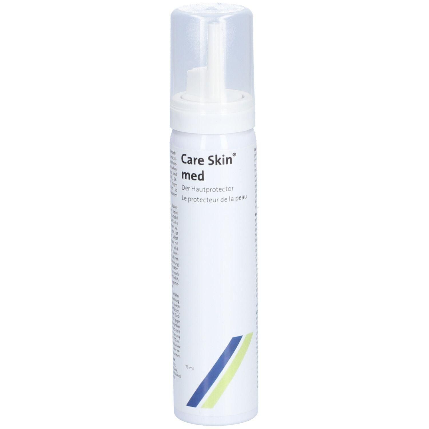 Flacon blanc avec tête de pulvérisation et bouchon transparent. Inscription : Care Skin med. Bandes bleues et jaunes.