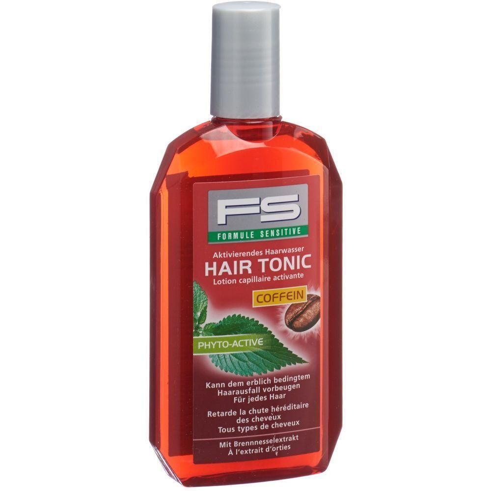 Flacon rouge avec bouchon argenté. Inscription: FS, HAIR TONIC COFFEIN. Contient de l'extrait d'ortie. Pour tous types de cheveux.