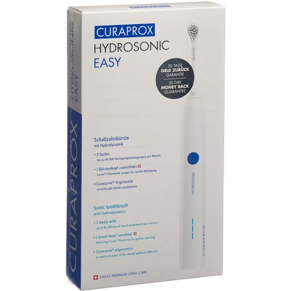 Verpackung der CURAPROX Hydrosonic Easy Schallzahnbürste. Weißes Gehäuse mit blauem Knopf. Text: 30 Tage Geld zurück Garantie.