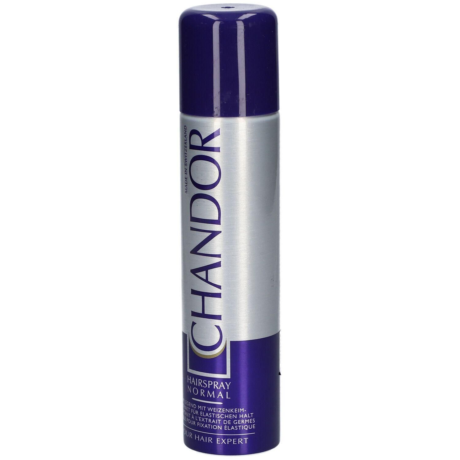 Haarspray-Dose mit blauem Deckel und silbernem Korpus. Der Schriftzug "CHANDOR" ist deutlich sichtbar. Aufschrift "HAIR EXPERT".