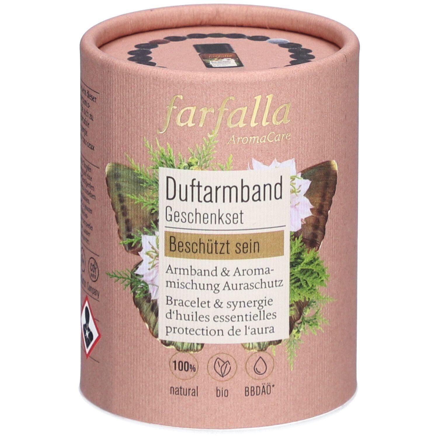 Zylindrische Geschenkbox. Aufschrift: farfalla AromaCare, Duftarmband Geschenkset, Beschützt sein. Mit Logo und Zertifizierungen.