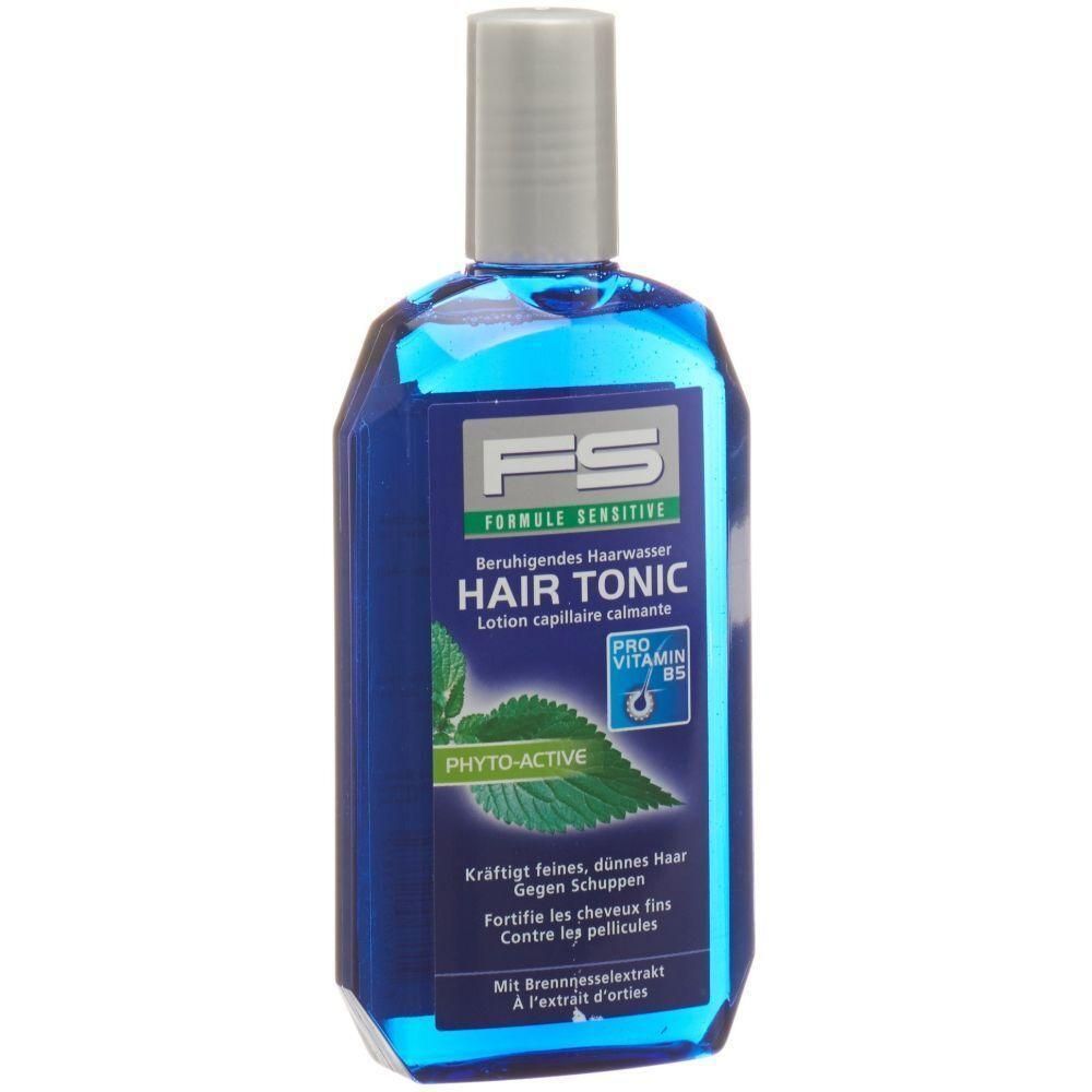 Flacon bleu avec bouchon argenté. Inscription: HAIR TONIC, PRO VITAMINE B5, PHYTO-ACTIVE. Contient de l'extrait d'ortie.