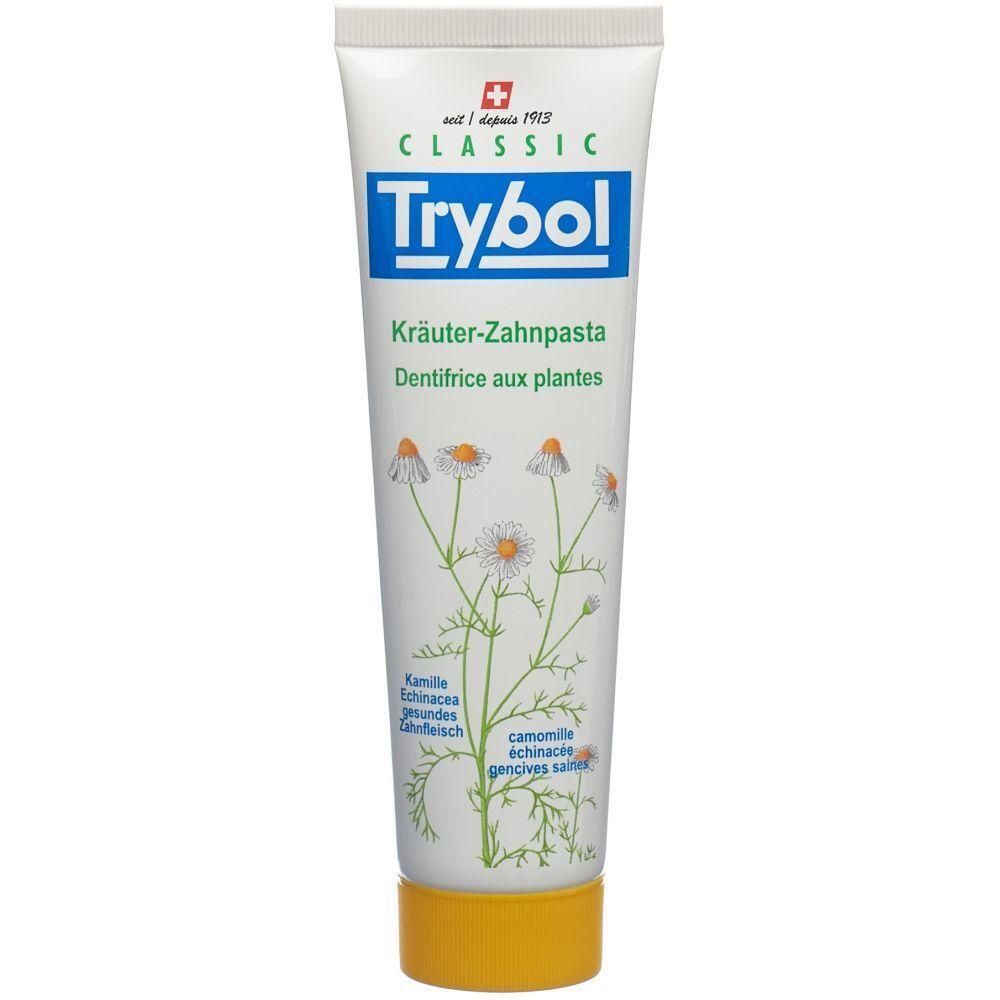 Zahncreme-Tube mit floralem Design. Aufschrift: Trybol Classic, Kräuter-Zahnpasta. Enthält Kamille und Echinacea.