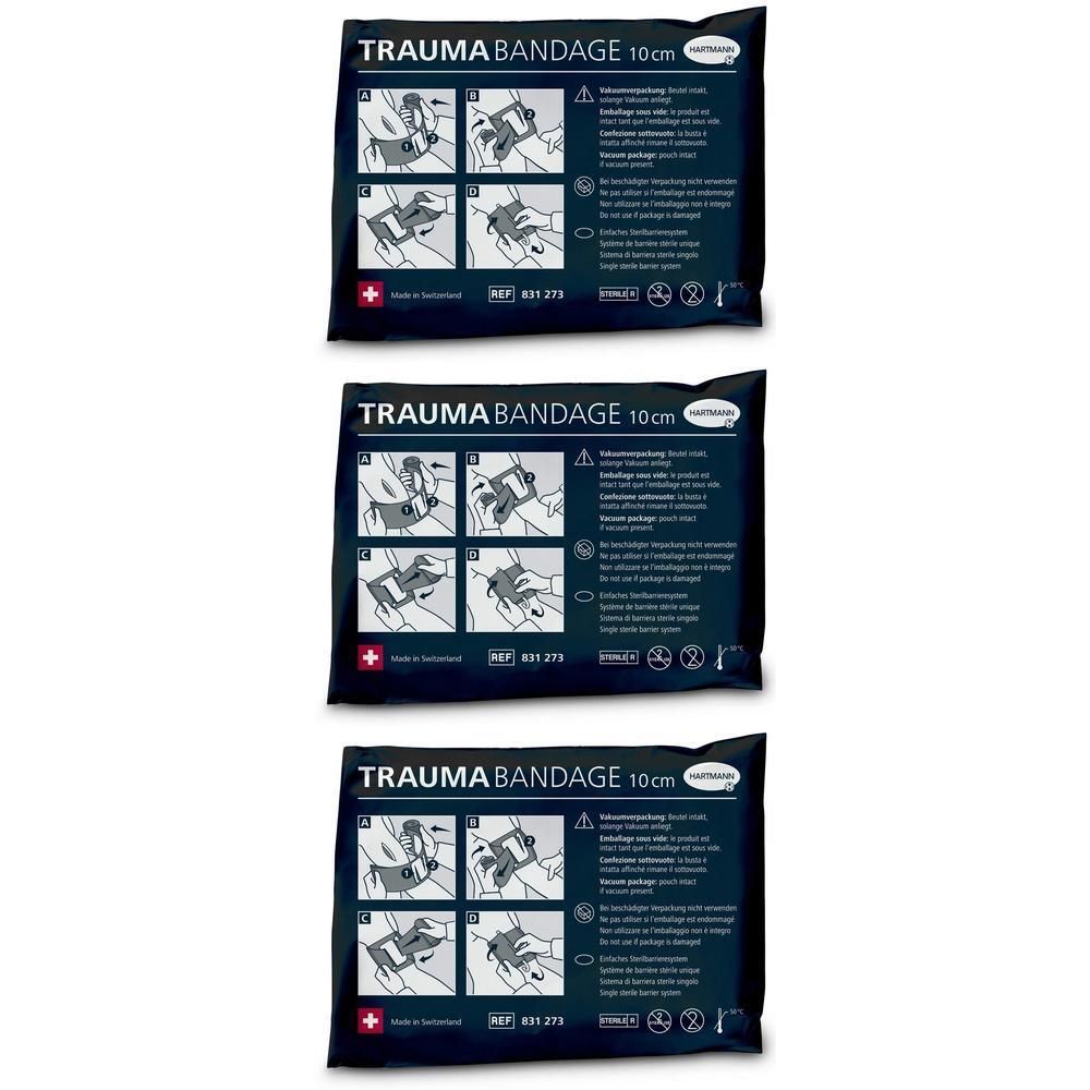 Drei schwarze Verpackungen mit der Aufschrift "TRAUMA BANDAGE 10cm". Schweizer Kreuz und Piktogramme sind sichtbar.