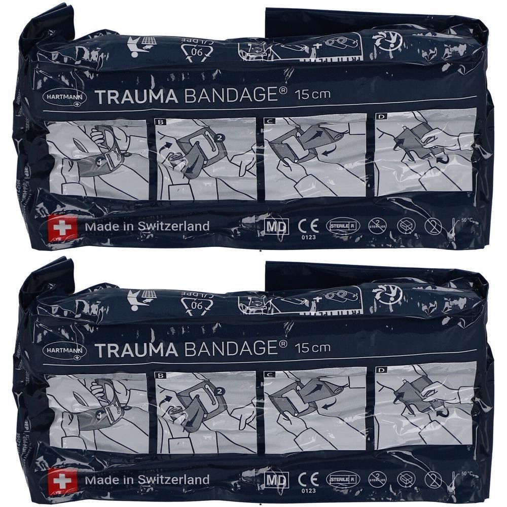 Zwei Packungen Trauma Bandage 15 cm. Blaue Verpackung mit Produktname, Abbildungen und Schweizer Kreuz. CE-Kennzeichnung.