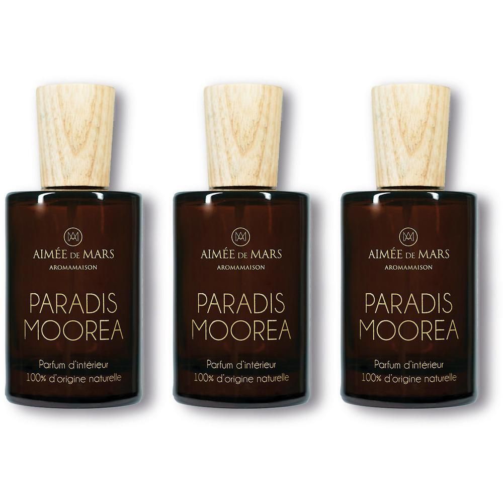 Trois flacons en verre brun avec bouchons en bois. Inscription: Paradis Moorea, Parfum d'intérieur, 100% d'origine naturelle.