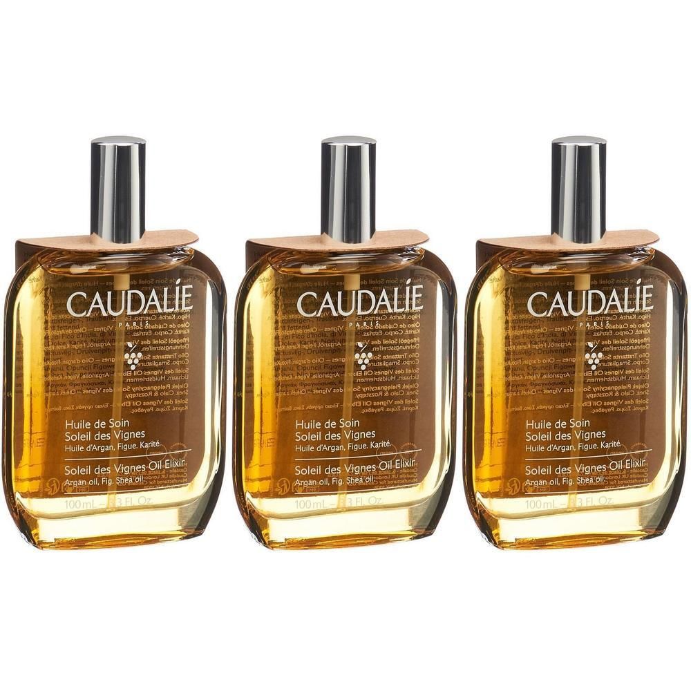 Trois flacons avec bouchons argentés et étiquettes marron. Chaque flacon porte la marque CAUDALIE et une indication de produit.