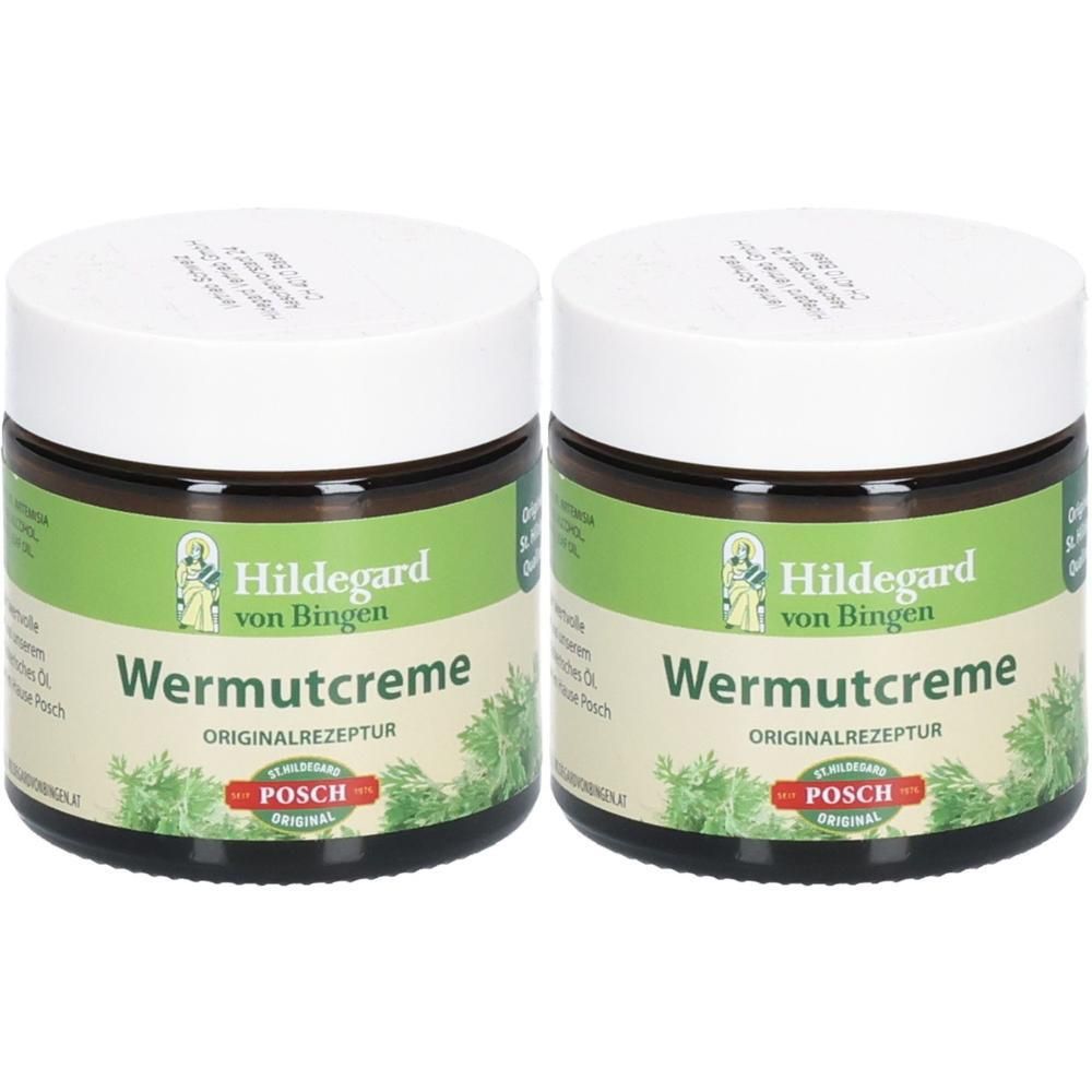 Zwei Gläser Hildegard Wermutcreme mit weißem Deckel und grünem Etikett. Abgebildet sind Kräuter und das Logo.