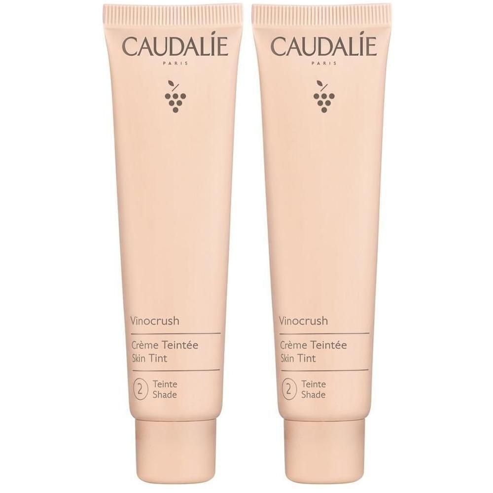 Zwei Tuben mit getönter Creme. Aufschrift CAUDALIE, Vinocrush, Crème Teintée Skin Tint, Farbton 2. Beige Verpackung.