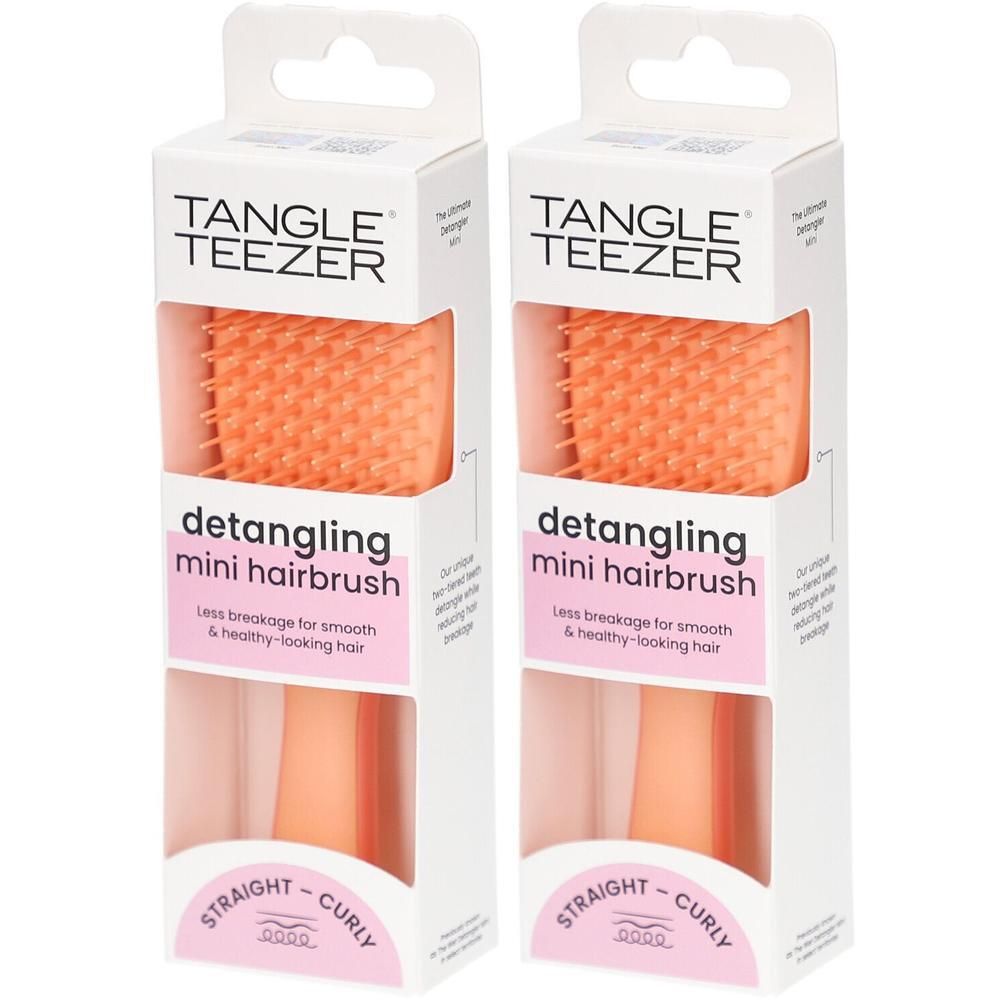 Zwei orangefarbene Tangle Teezer Mini Entwirrungsbürsten in weißer Verpackung.