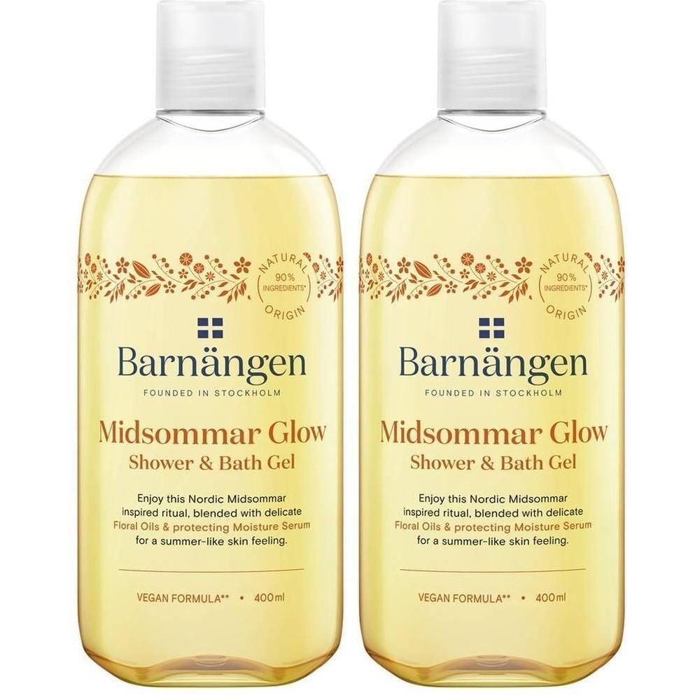 Deux bouteilles de gel douche et bain Barnängen "Midsommar Glow". Liquide jaune dans des bouteilles transparentes avec bouchon blanc.