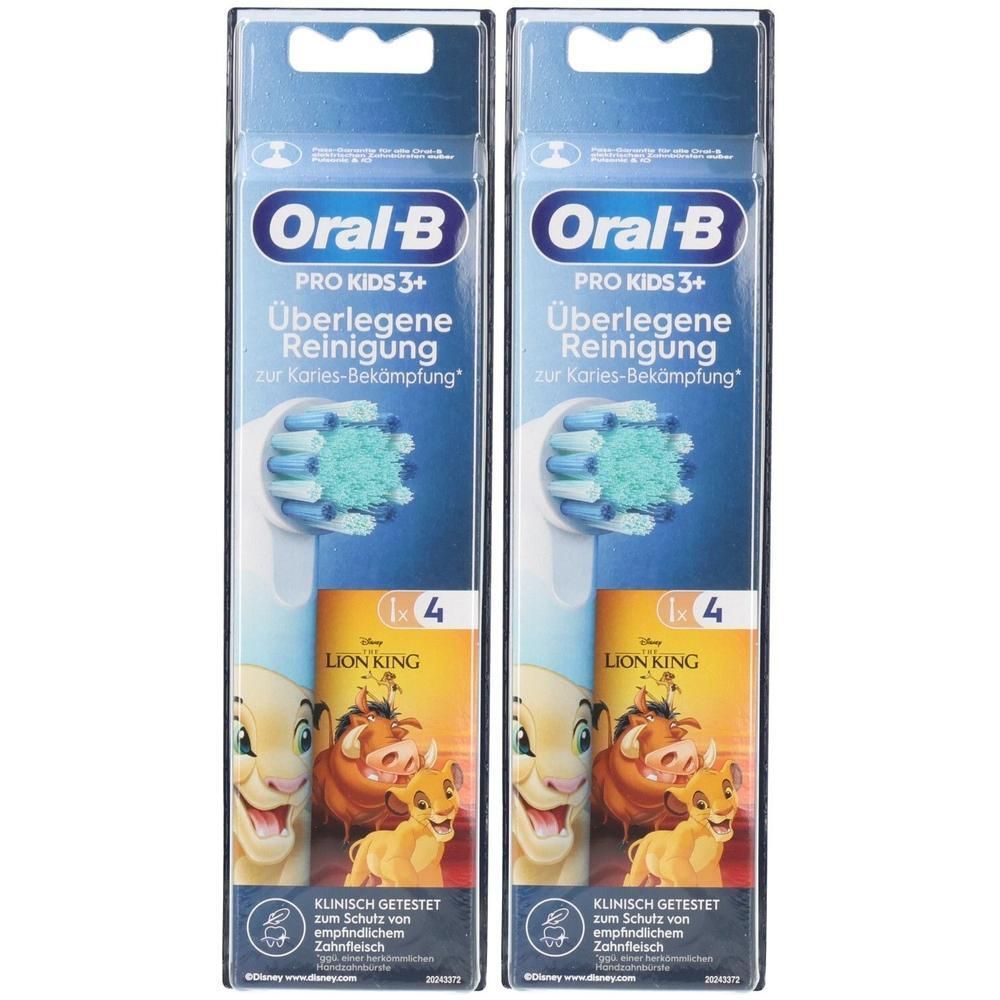 Deux paquets de brossettes Oral-B Pro Kids 3+. Emballage avec motif Le Roi Lion. Têtes de brosse bleues avec poils verts. Testé cliniquement.