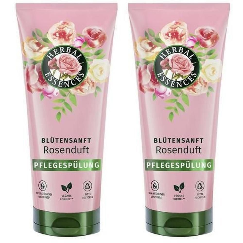 Deux tubes de revitalisant HERBAL ESSENCES. Emballage rose avec motif floral et noms de produits. Bouchon vert.