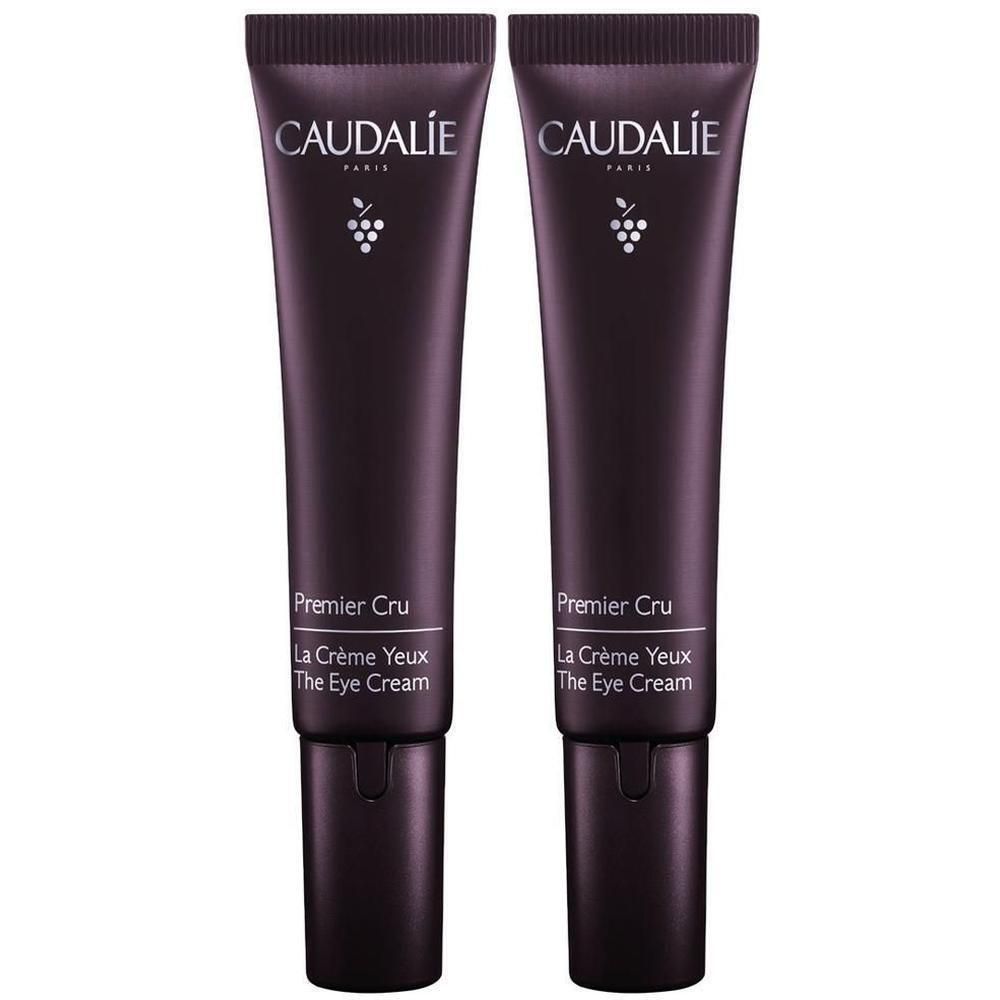 Deux tubes de crème pour les yeux. Tubes violets foncés avec l'inscription blanche CAUDALIE, Premier Cru, La Crème Yeux, The Eye Cream.