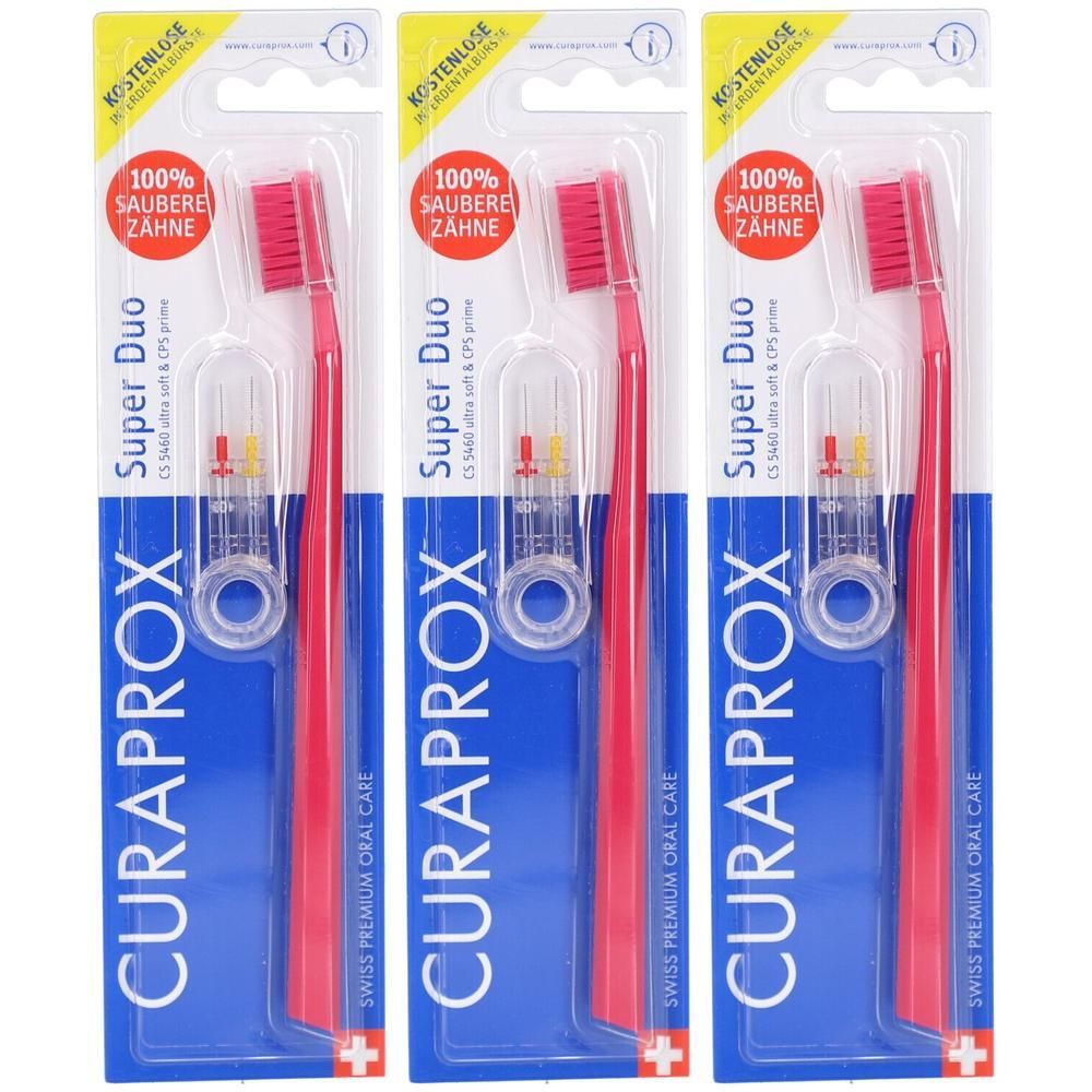 Trois brosses à dents et supports en blister. Brosses rouges avec supports transparents. Marque : CURAPROX. Inscription : Super Duo.