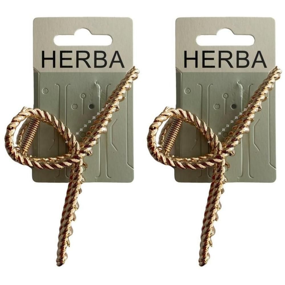 Zwei goldene Haarklammern mit Seil-Design, jeweils auf einer grauen Karte mit der Aufschrift "HERBA".
