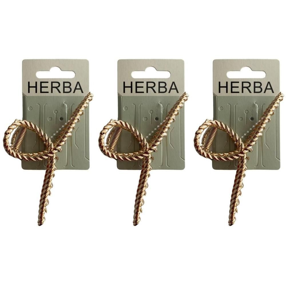 Drei goldene Haarklammern mit Seil-Design, jeweils auf einer grauen Karte mit der Aufschrift 'HERBA'.