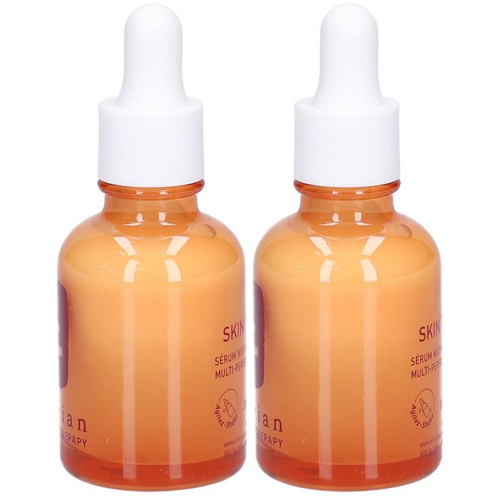 Zwei Flaschen mit orangefarbenem Serum und Pipettenverschluss. Etikett mit "Erborian Skin Therapy" und "Serum Nuit Multi-Peptide".