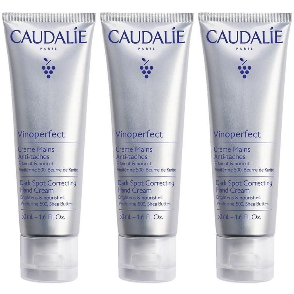 Trois tubes de crème pour les mains. Chaque tube porte la marque CAUDALIE, Vinoperfect, Crème Mains Anti-taches. Contient 50 ml.