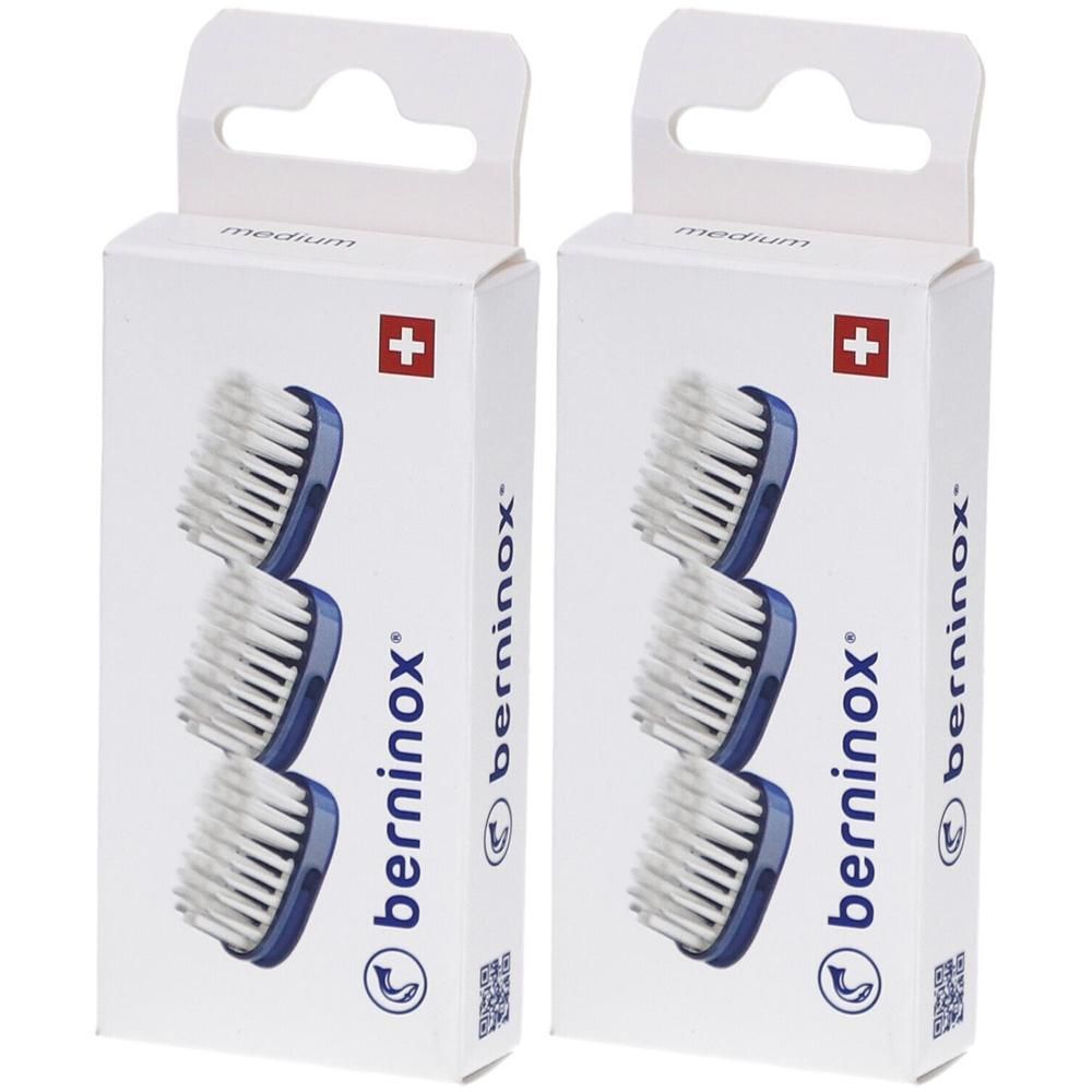 Zwei Packungen Ersatzköpfe. Jede Packung enthält drei blaue Bürstenköpfe. Schweizer Kreuz auf der Verpackung. Marke: berninox.