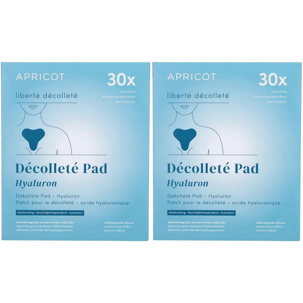 Zwei quadratische Kartons. Aufschrift: APRICOT, liberté décolleté, Décolleté Pad Hyaluron. Abbildung eines Dekolletés mit Pad.
