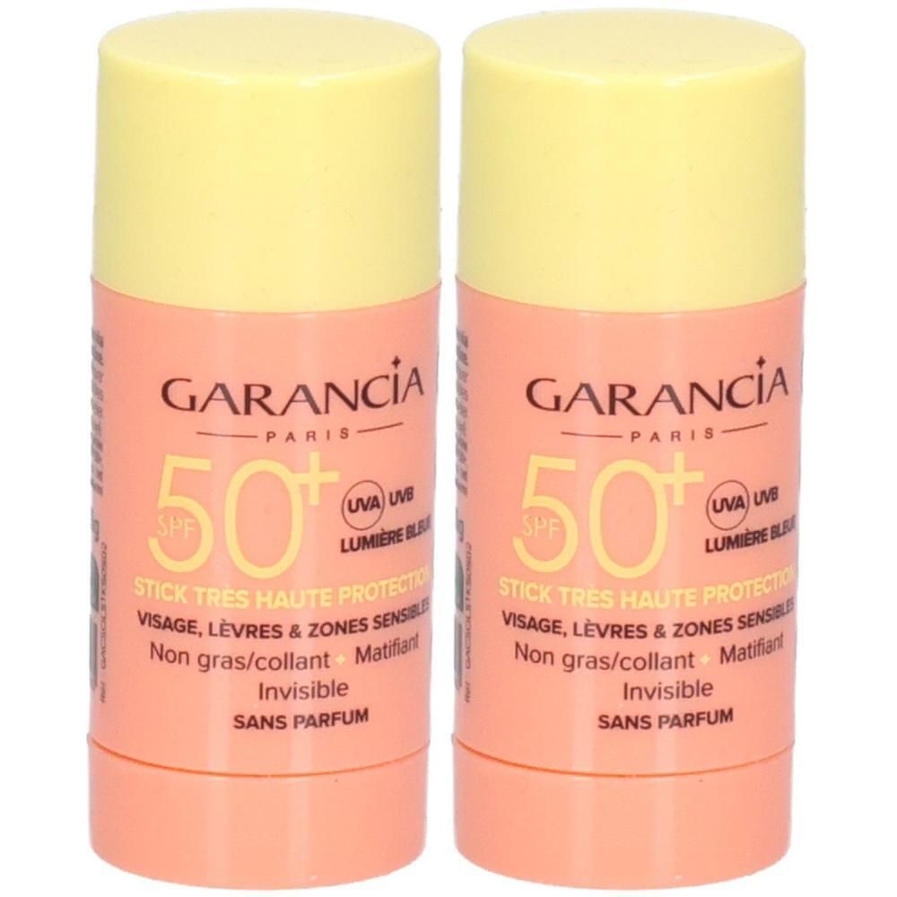 Zwei zylindrische Sonnenstifte. Aufschrift: GARANCIA PARIS, SPF 50+. Für Gesicht, Lippen und empfindliche Bereiche. Nicht fettend, mattierend, unsichtbar, parfümfrei.