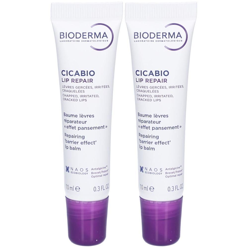 Zwei Tuben Lippenbalsam. Weiß mit lila Akzenten. Aufschrift: BIODERMA CICABIO LIP REPAIR. Für rissige Lippen.