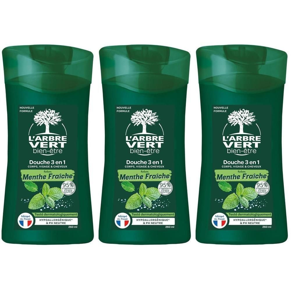 Trois flacons de gel douche L'Arbre Vert 3-en-1 Menthe Fraîche. Flacons verts avec étiquette blanche et motif feuille de menthe.